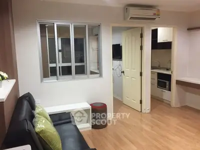 Modern apartment interior with cozy living room and compact kitchen