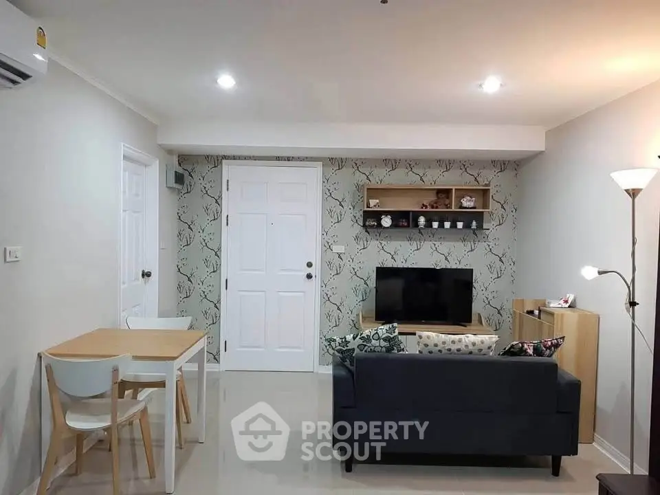 Modern living room with stylish decor and cozy seating area, perfect for relaxation and entertainment.