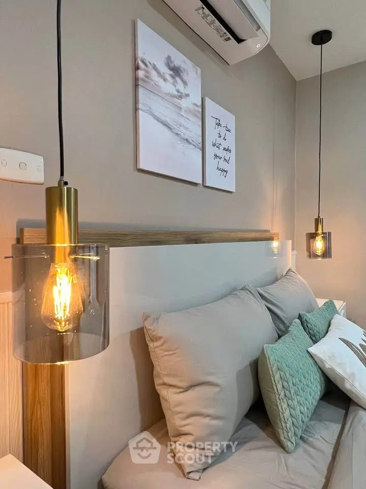 Cozy bedroom with modern lighting and stylish decor, perfect for relaxation and comfort.