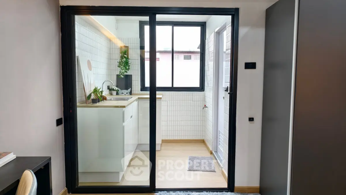 Modern kitchen with sleek design and ample natural light