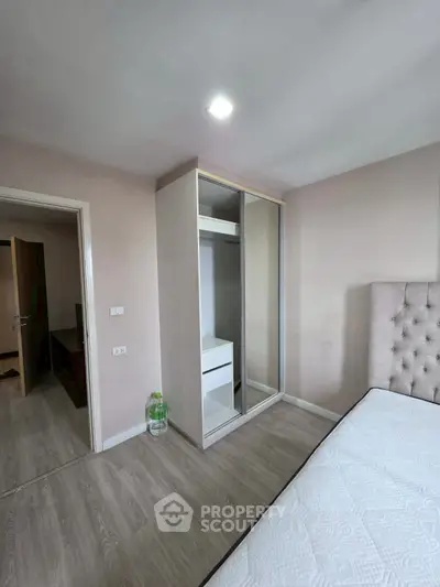 Modern bedroom with stylish wardrobe and comfortable bed in a cozy apartment.