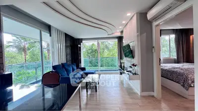 Luxurious modern living room with large windows and garden view, featuring stylish decor and open layout.