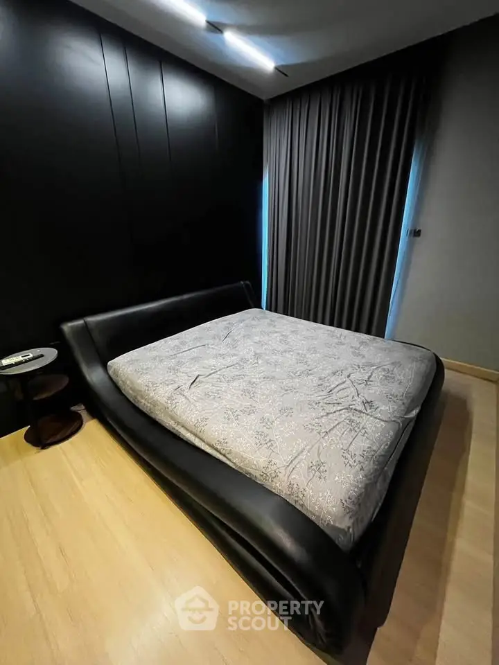 Luxurious modern bedroom with sleek black accents and cozy lighting