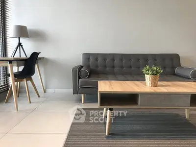 Modern living room with stylish gray sofa and wooden coffee table, perfect for contemporary homes.