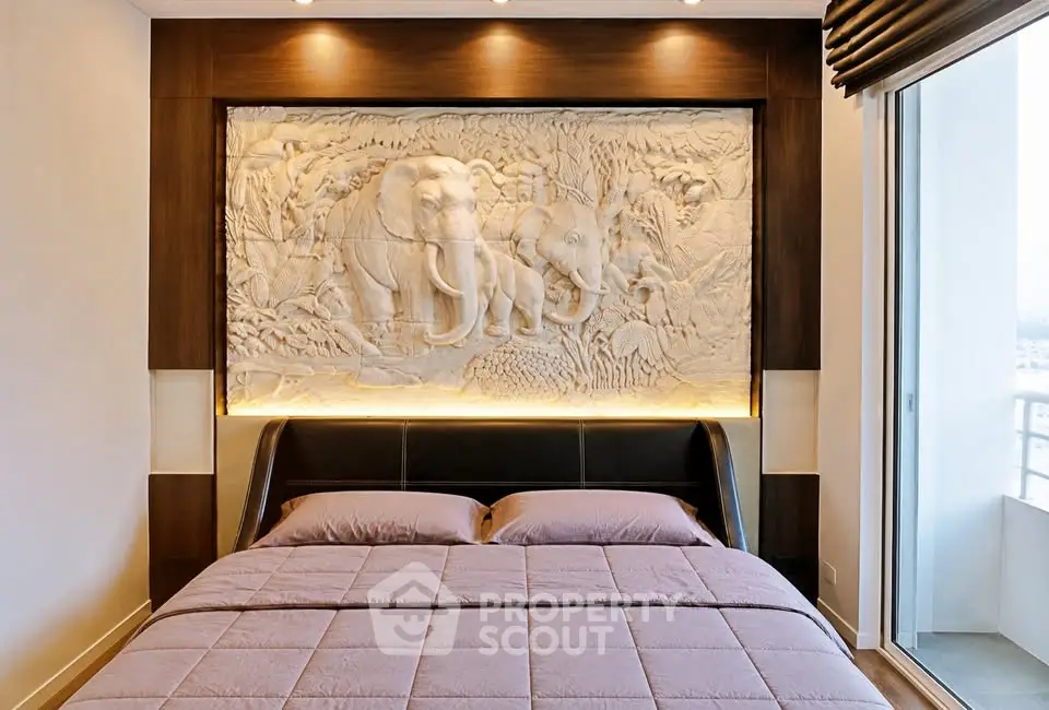 Luxurious bedroom with elegant elephant wall art and balcony view