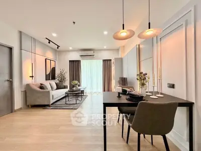 Modern open-plan living room with stylish decor and natural light