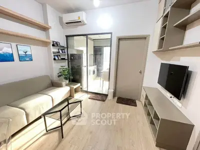 Modern living room with sleek design, featuring a cozy sofa, wall-mounted TV, and stylish shelving.