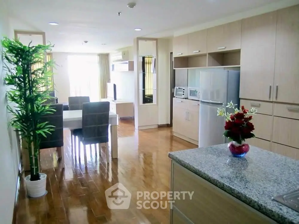 Spacious open-layout kitchen and dining area with modern appliances and elegant decor.