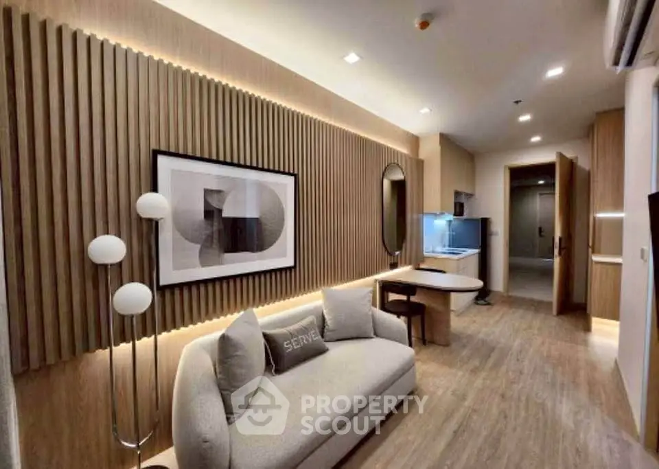 Modern living room with stylish decor and cozy seating in a contemporary apartment.