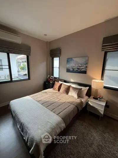 Cozy bedroom with modern decor and natural light