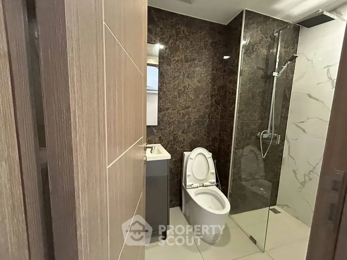 Modern bathroom with glass shower and sleek design