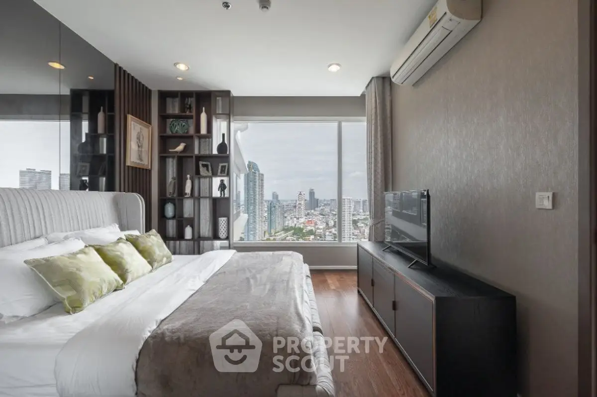Luxurious bedroom with city view, modern decor, and large window for natural light.