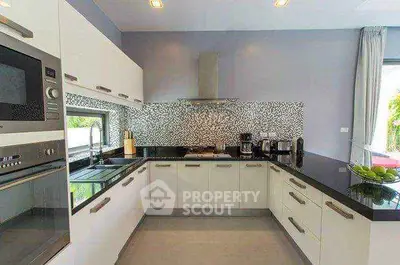 Modern kitchen with sleek design and high-end appliances