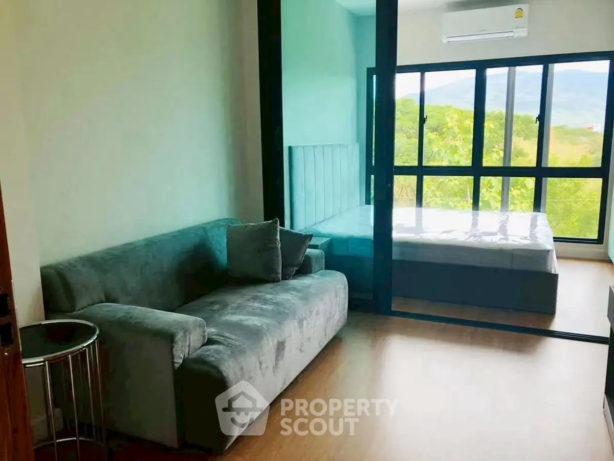 Modern studio apartment with glass partition and scenic view