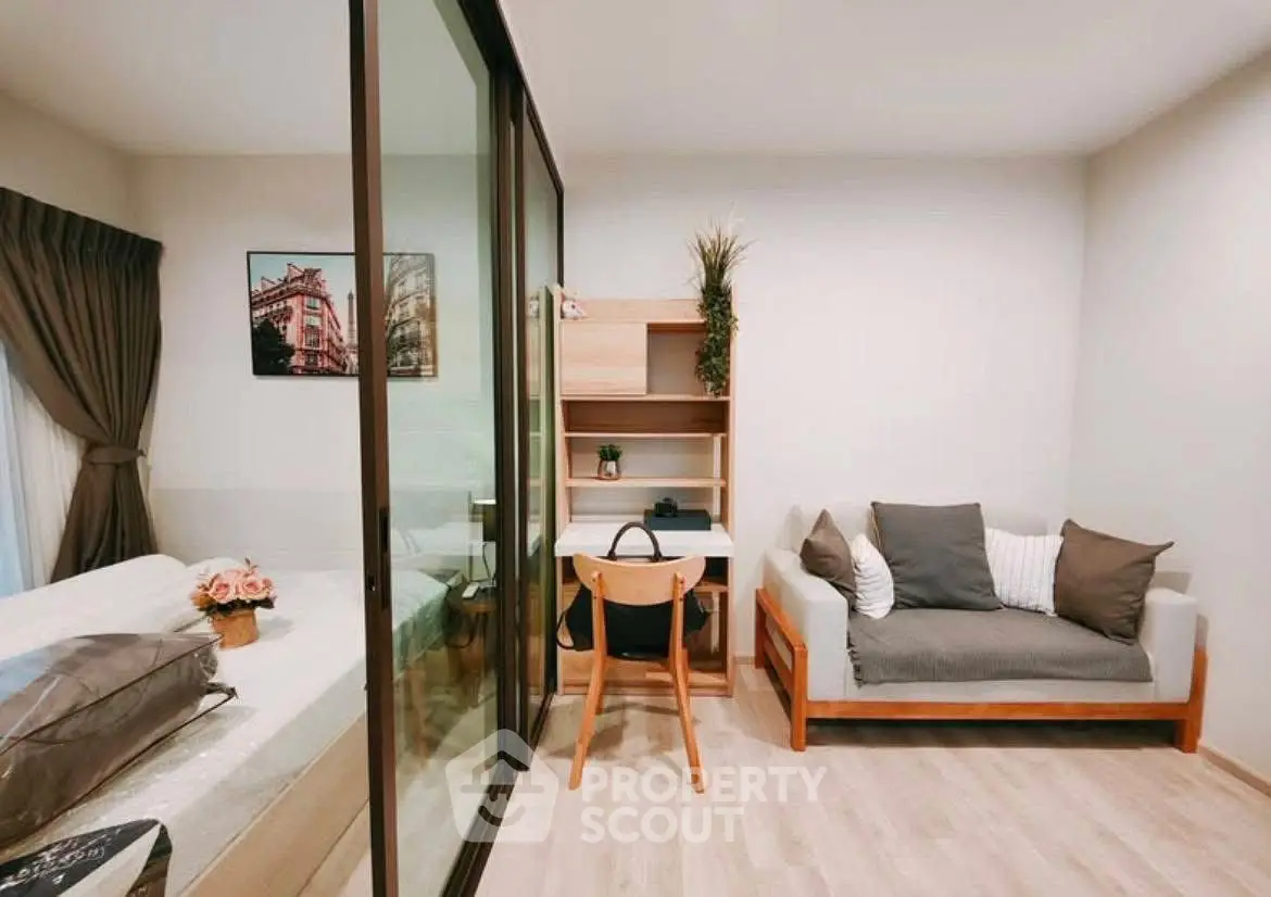 Modern living room with cozy sofa and stylish decor in a bright apartment.