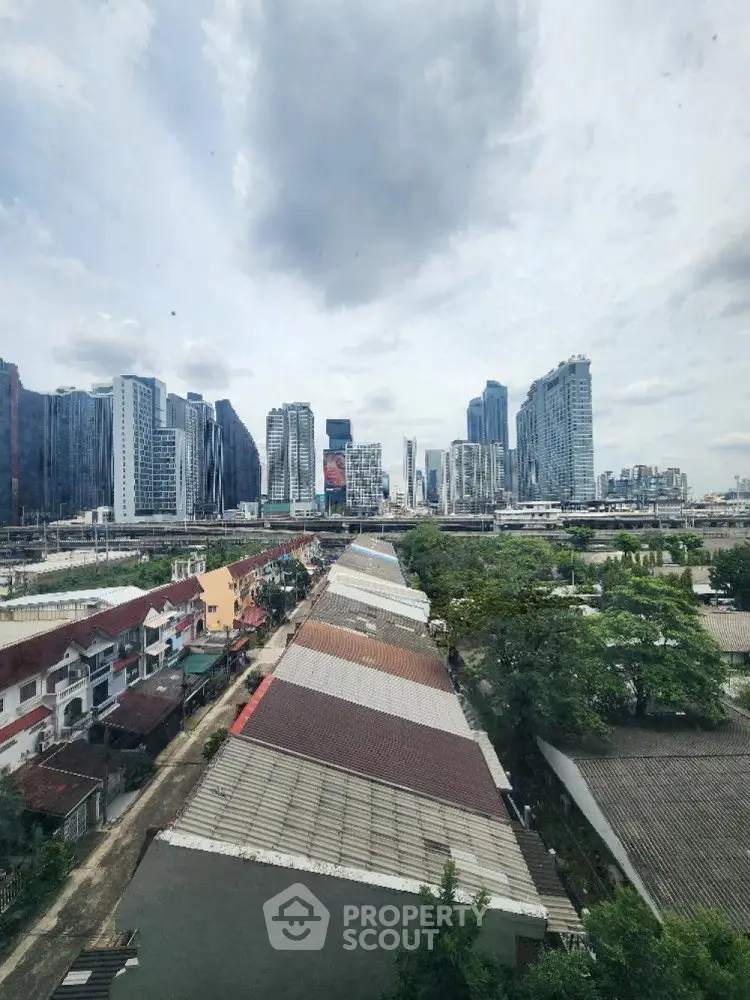 Stunning cityscape view showcasing modern skyscrapers and residential rooftops, perfect for urban living enthusiasts.