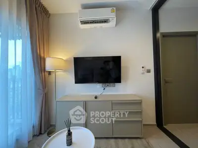 Modern living room with wall-mounted TV and air conditioning
