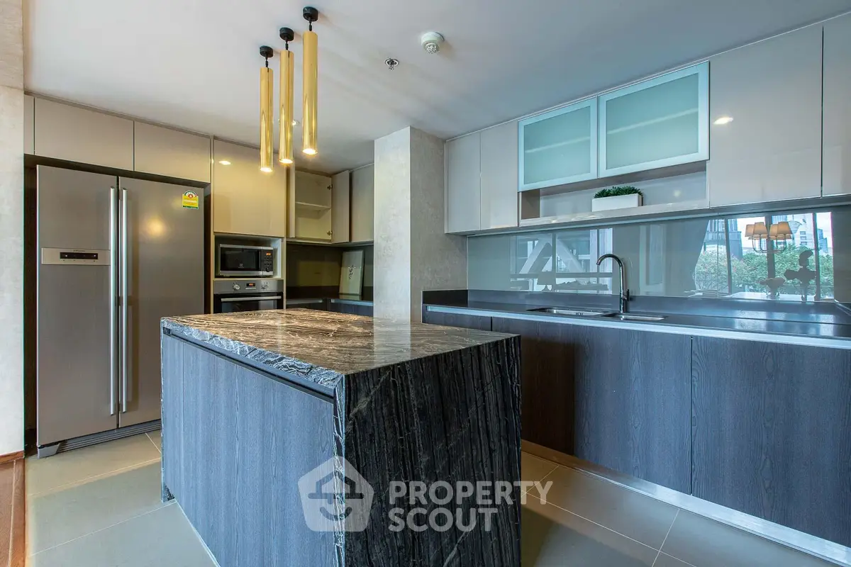 Luxurious modern kitchen with sleek island and stainless steel appliances