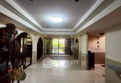 Spacious living room with elegant decor and large windows for natural light.