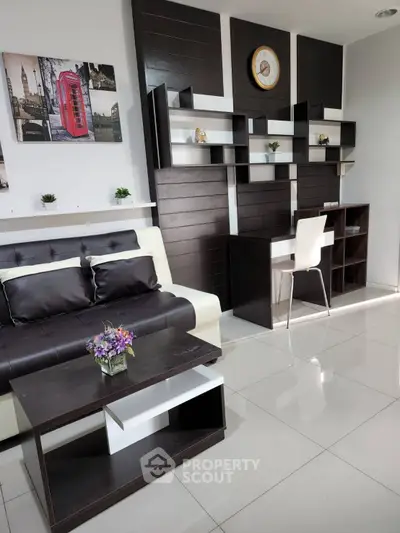 Modern living room with sleek furniture and stylish shelving unit