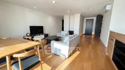 Spacious modern living room with wooden flooring and stylish furniture