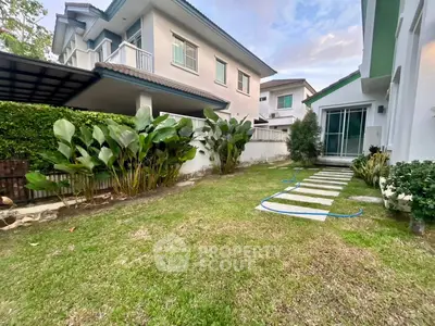 Charming suburban garden with lush greenery and modern pathway, perfect for outdoor relaxation.