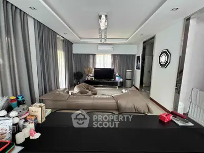 Spacious modern living room with elegant decor and ample natural light