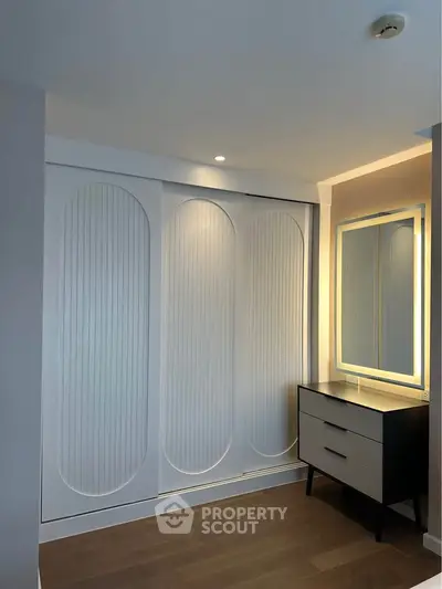 Elegant modern bedroom with stylish wardrobe and chic dresser