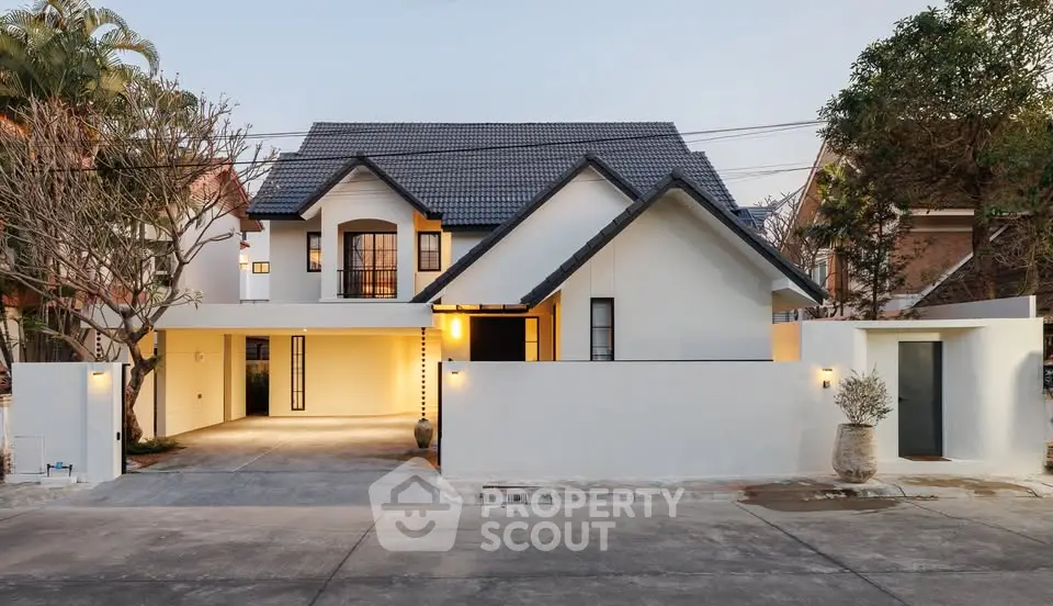 Charming modern house with spacious driveway and elegant architecture, perfect for family living.