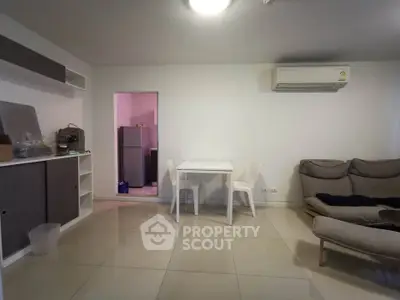 Modern living room with minimalist furniture and air conditioning