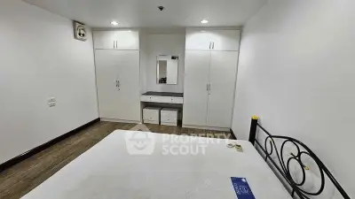 Spacious bedroom with built-in wardrobes and modern decor