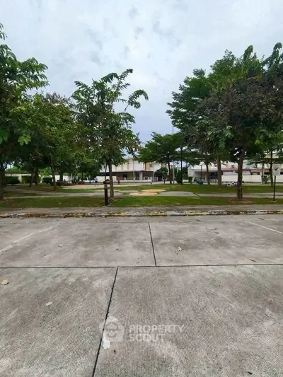 Spacious residential area with lush greenery and modern architecture.