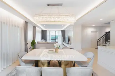 Luxurious modern dining room with elegant chandelier and stylish decor
