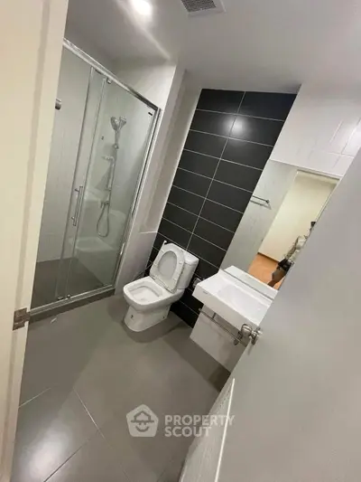Modern bathroom with sleek design and glass shower enclosure