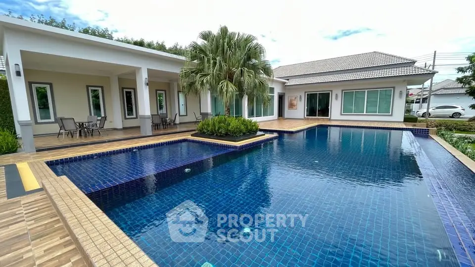 Luxurious villa with stunning pool and modern architecture, perfect for serene living.