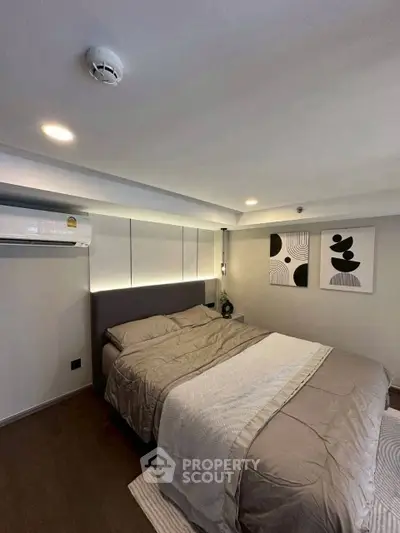 Cozy modern bedroom with stylish decor and ambient lighting