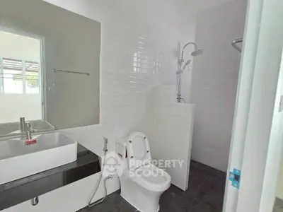 Modern bathroom with sleek fixtures and white subway tiles