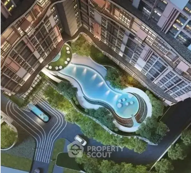 Stunning aerial view of luxury apartment complex with elegant pool and lush landscaping.