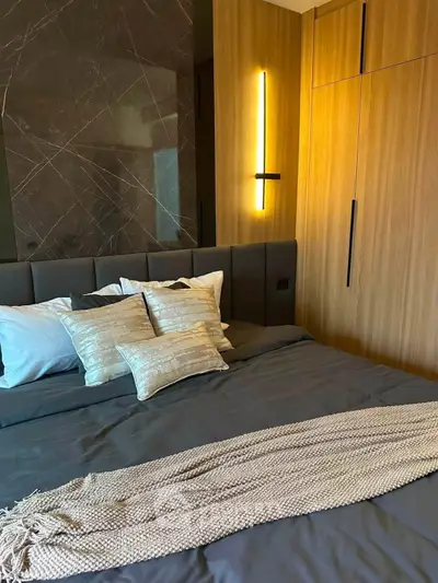 Luxurious bedroom with modern design and elegant lighting