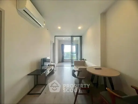 Modern living room with air conditioning and stylish furniture