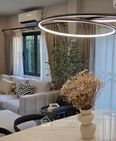 Modern living room with stylish lighting and elegant decor