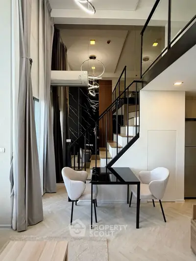 Modern duplex living room with stylish staircase and elegant furniture