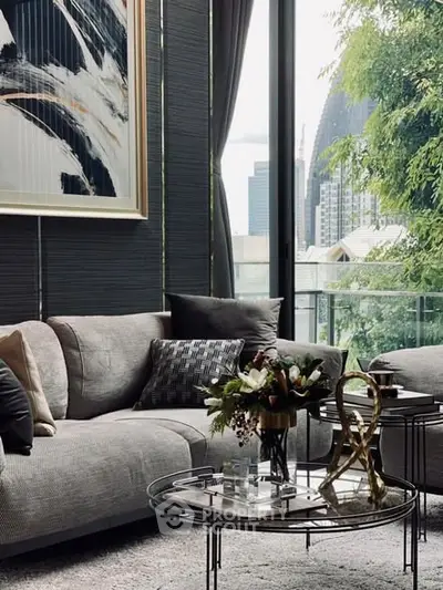 Luxurious living room with modern decor and stunning city view through large windows.