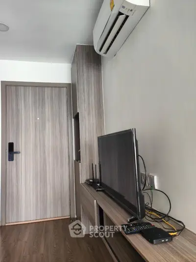 Modern living room with air conditioning and sleek wooden furniture