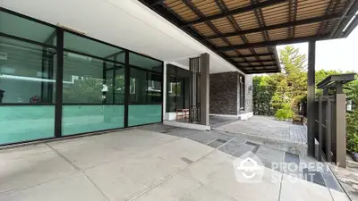 Modern home entrance with sleek design and spacious driveway