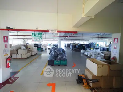 Spacious warehouse interior with organized storage and clear pathways