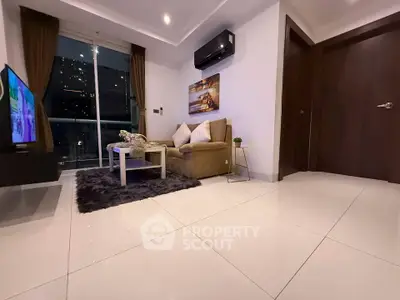 Modern living room with city view, cozy seating, and sleek decor.