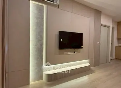 Modern living room with sleek TV wall and ambient lighting