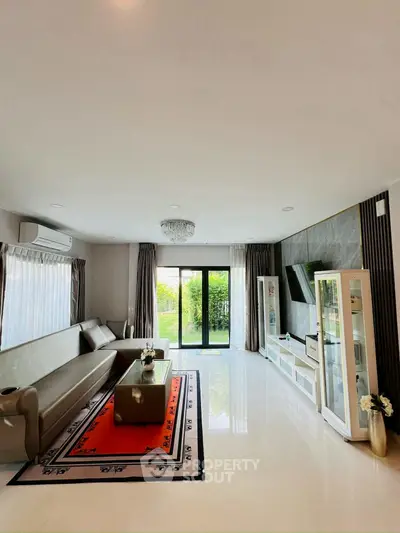 Spacious modern living room with elegant decor and garden view