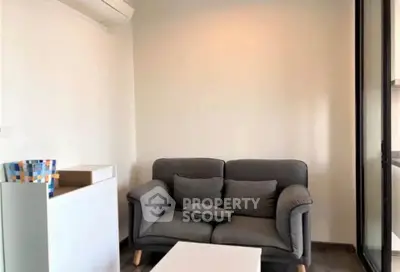Cozy living room with modern gray sofa and minimalist decor